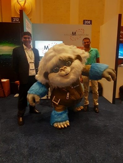 ValueMomentum’s team stands with Ice, OpenText’s yeti mascot